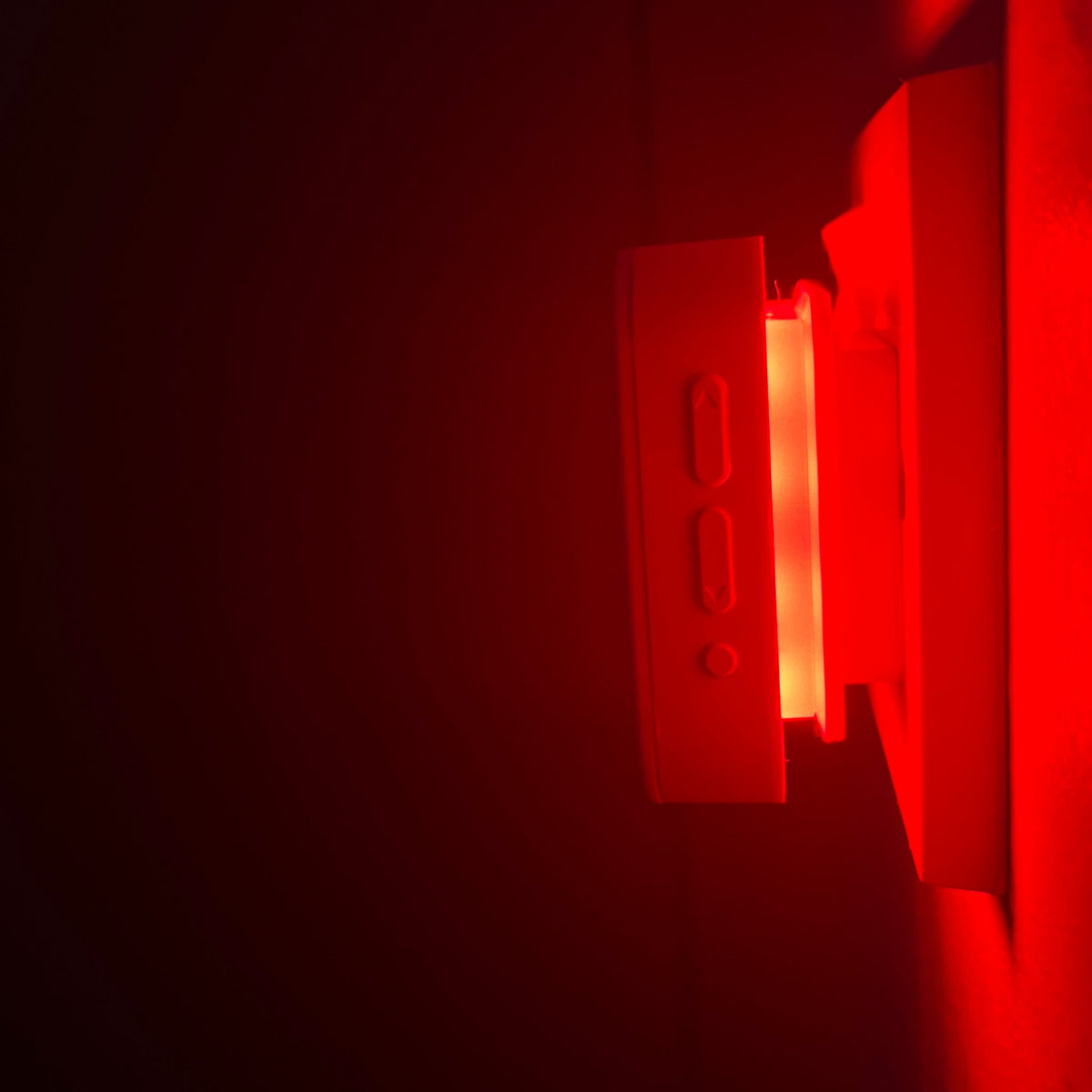 Close-up of the Driftback night light glowing red in the dark